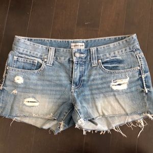 Distressed denim shorts
